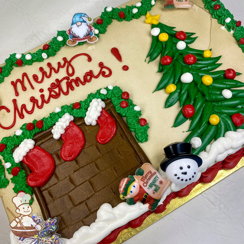 Sheet cake with buttercream chimney, red stockings, and a green Christmas tree with colorful ornaments. Plastic snowman and elf toys are also present.
