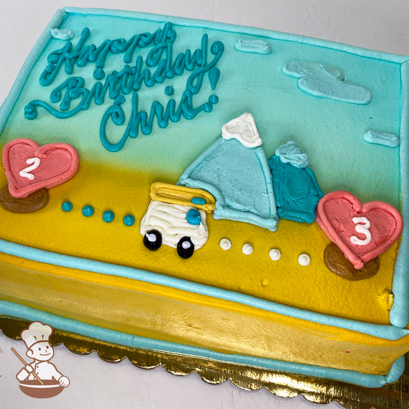 Sheet cake with buttercream decorations of a van, mountains, clouds, and location pins shaped like hearts with numbers "2" and "3." Blue and yellow gradient background.