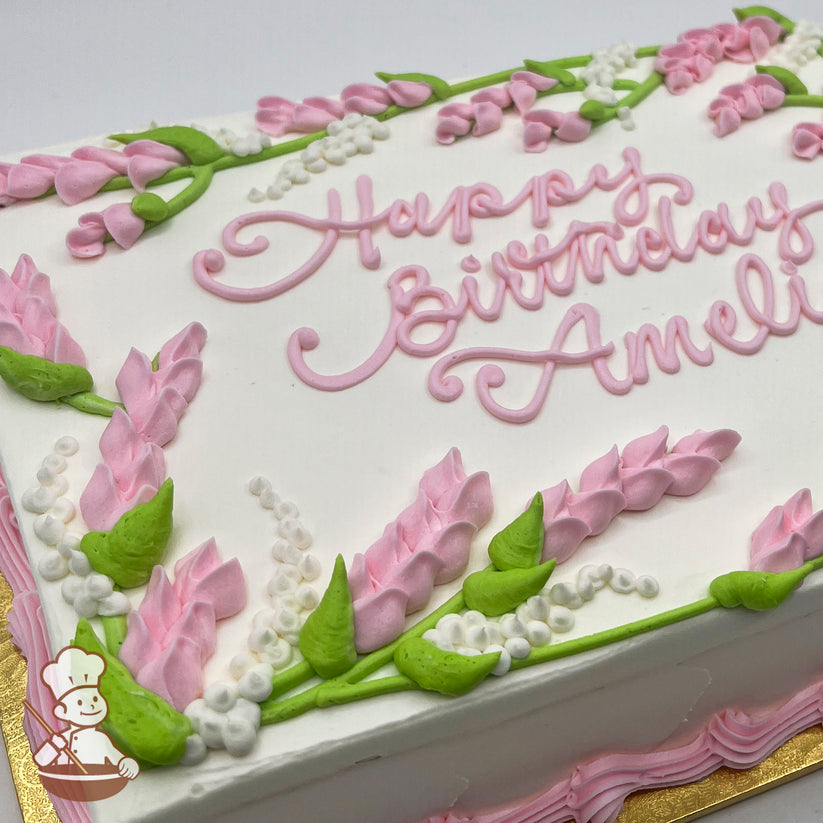 Sheet cake with pink buttercream lavender florals, green leaves, and white lupine flowers decorating the edges.