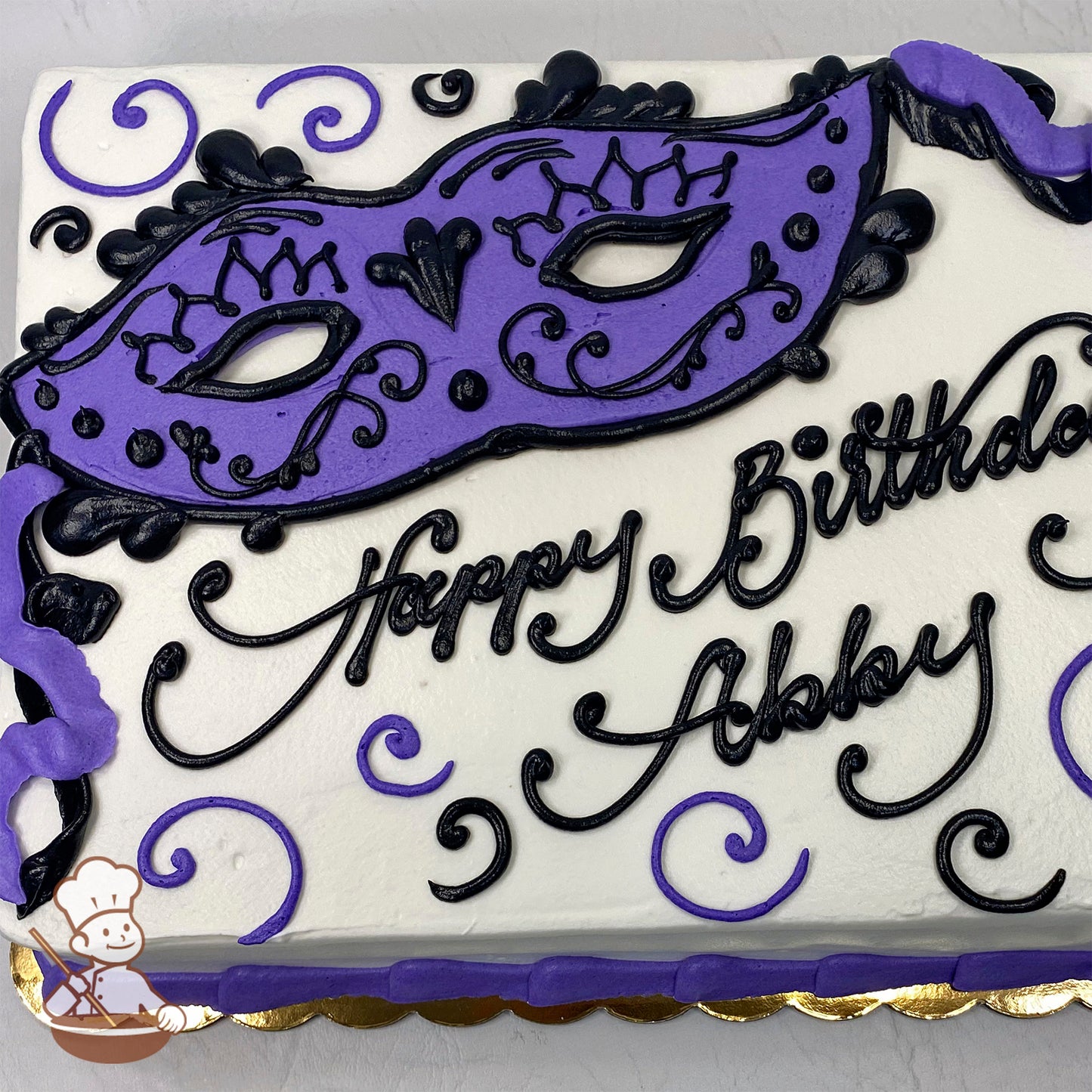 Sheet cake with a purple masquerade mask design, black scrolls, and purple swirls on white icing.