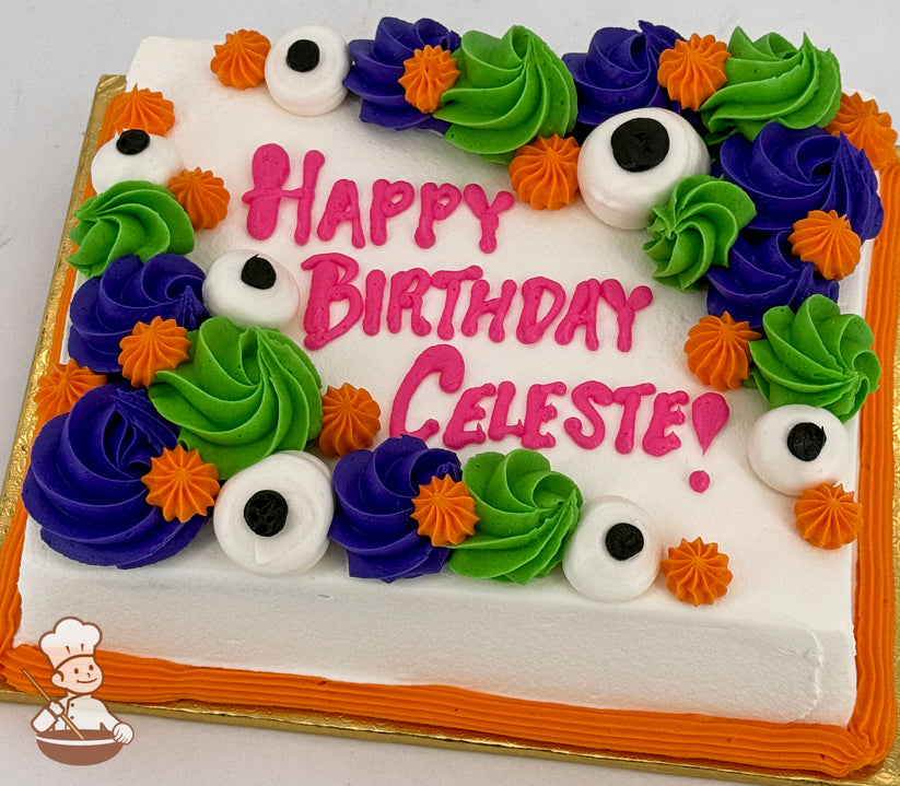 Sheet cake with white frosting, decorated with purple and green swirls, orange star shapes, and large white monster eyes. Orange border trim.