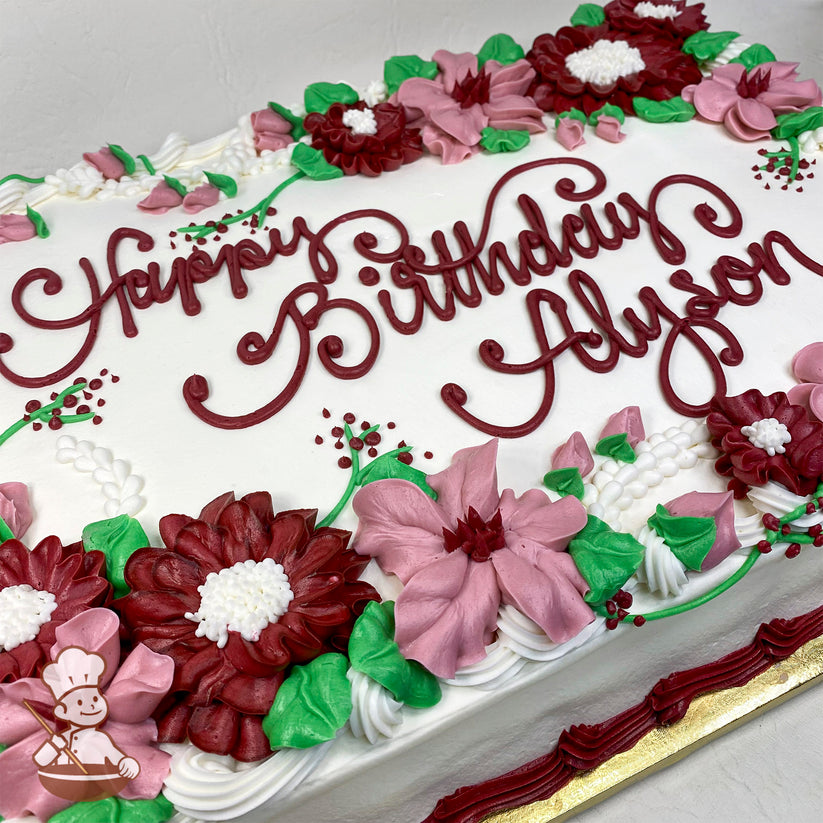 White sheet cake with buttercream decorations featuring burgundy mums, pink blossom flowers, green leaves, white piped accents, and a burgundy border.