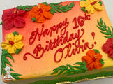 Ombre sheet cake with red, orange, and yellow buttercream hibiscus flowers, green leaf accents, and a gradient background of red, orange, and yellow.