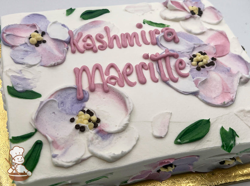 Sheet cake with white frosting, decorated with pastel painted flowers in pink, purple, and yellow, and green leaves.