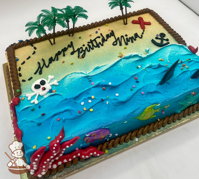 Sheet cake with buttercream decorations featuring a beach and ocean theme, with plastic palm trees, a red "X," an anchor, a skeleton head, plastic shark fins, fish, and a starfish. Rope trim borders the cake.