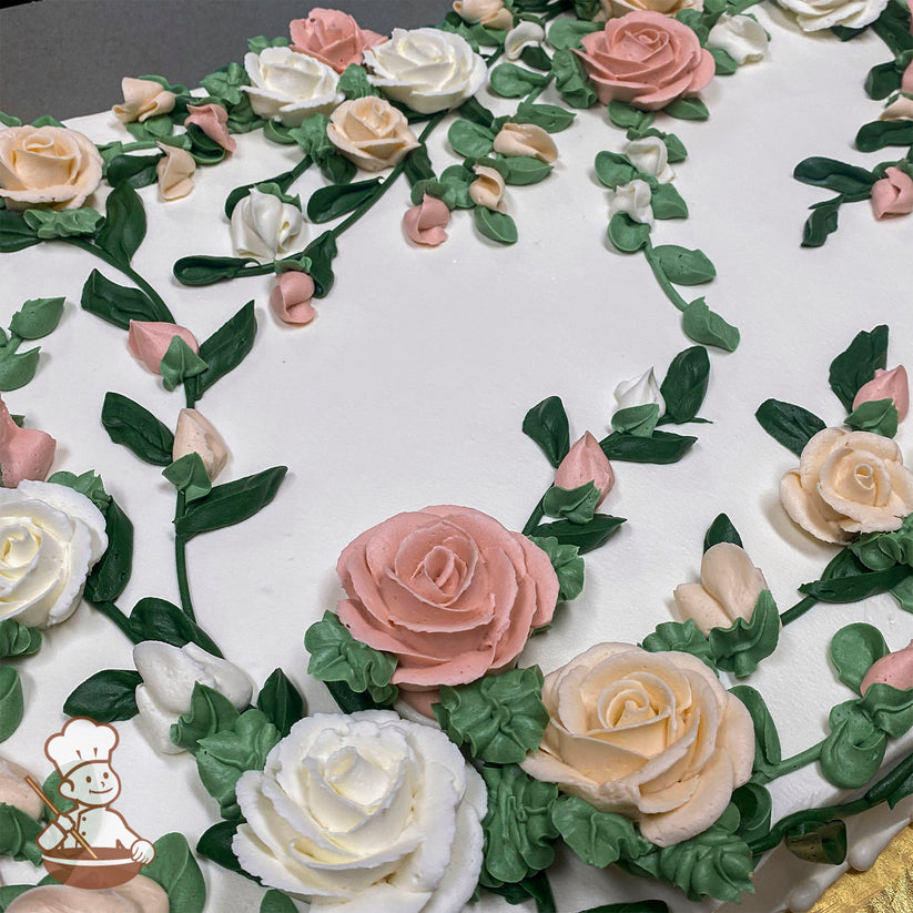Sheet cake with buttercream decorations of pink, white, and peach roses, surrounded by green leaves and vines, creating a floral design.