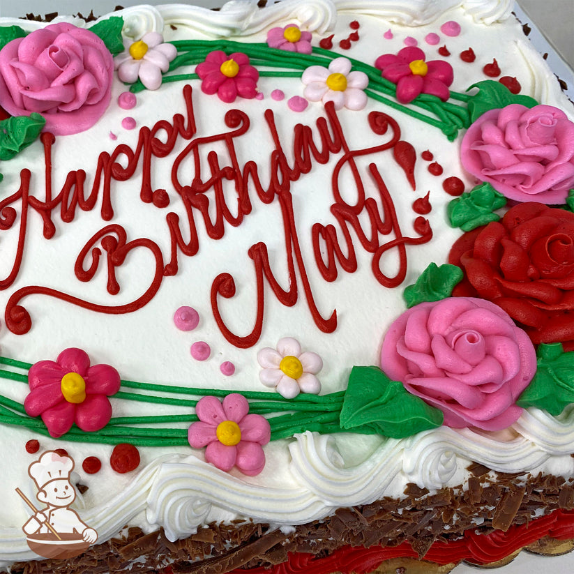 Sheet cake with buttercream decorations, featuring pink and red roses, pink daisies, green vines, leaves, and red dots on white frosting.