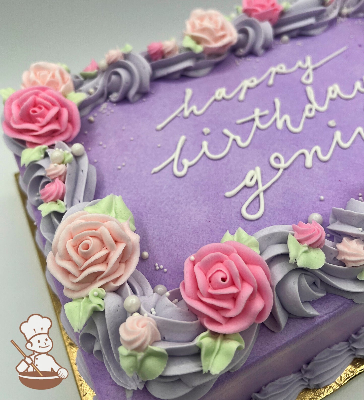 Purple sheet cake with pink and light pink buttercream roses, lavender swirl trim, and small sugar white pearls.