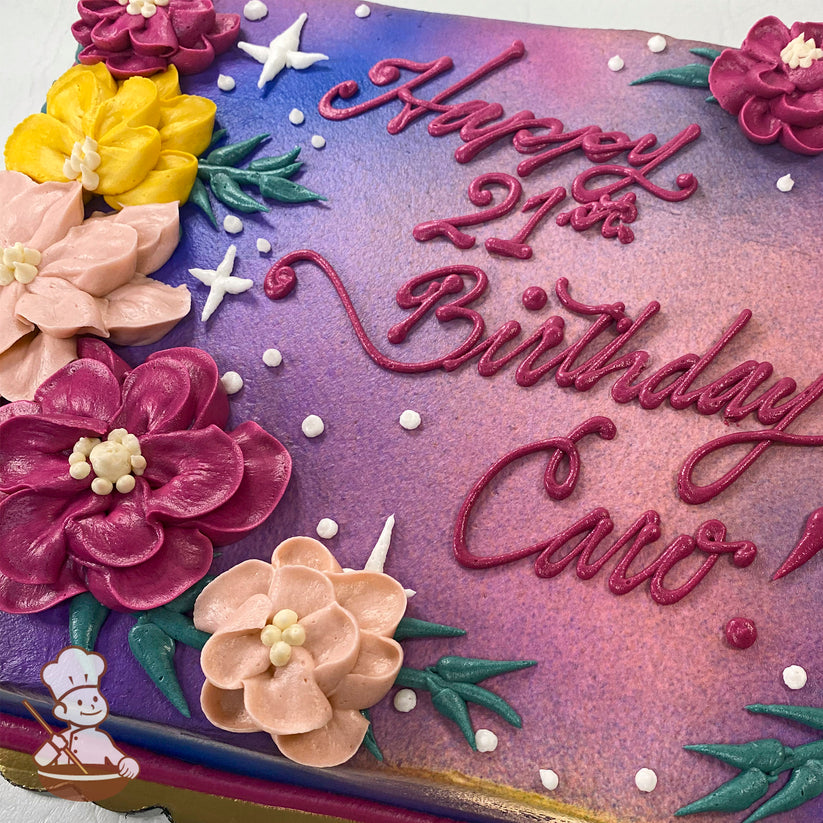 A colorful sheet cake with a gradient purple and pink background, decorated with buttercream flowers in yellow, pink, and magenta, green leaves, white star-shaped accents, and small white dots.
