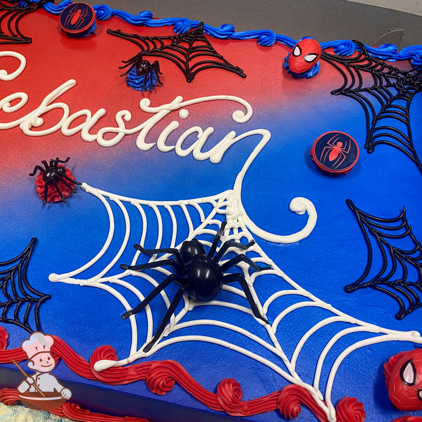 Sheet cake with red and blue frosting, black and white spider web designs, plastic Spider-Man rings, and toy spiders as decorations.