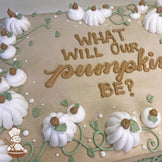 Sheet cake with buttercream pumpkins, green vines, and white dots. White pumpkins with brown stems and green leaves decorate the surface.