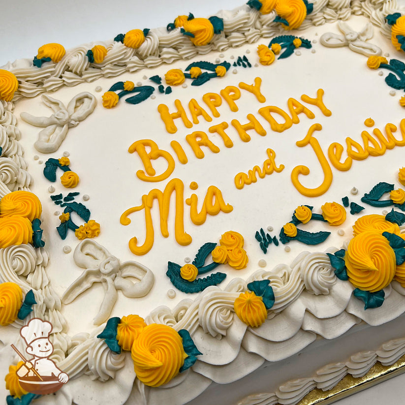 Sheet cake with off white base, decorated with yellow buttercream rosettes, teal green leaves, white swirlettes, ruffle trim, and off white buttercream bows.