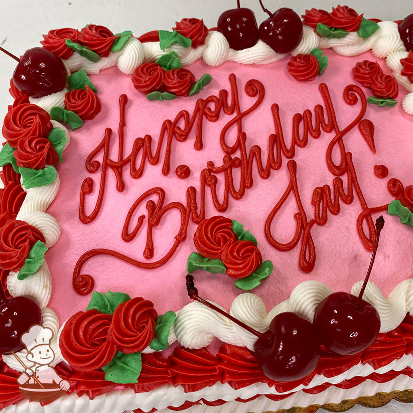 Pink sheet cake with red buttercream swirlette flowers, white and red vintage piping, green leaves, and maraschino cherries as decorations.