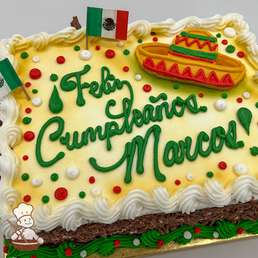Sheet cake with white frosting, yellow gradient, red and green dots, Mexican flags, a colorful sombrero decoration, and piped white borders.