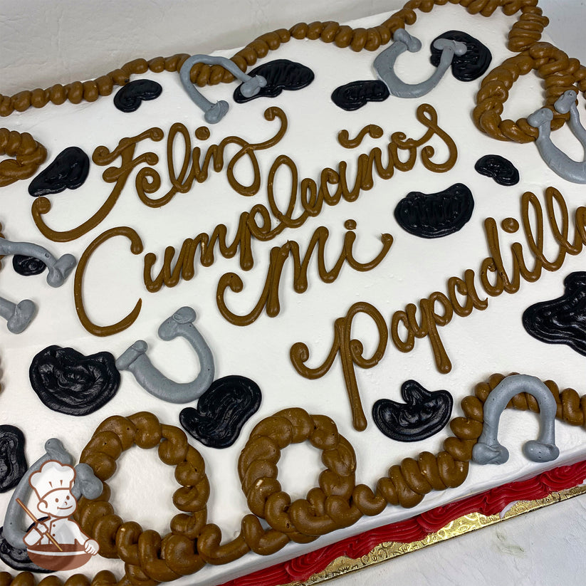 Sheet cake with white frosting, decorated with brown rope trim, gray horseshoes, and black cow print patterns. Red border at the base.