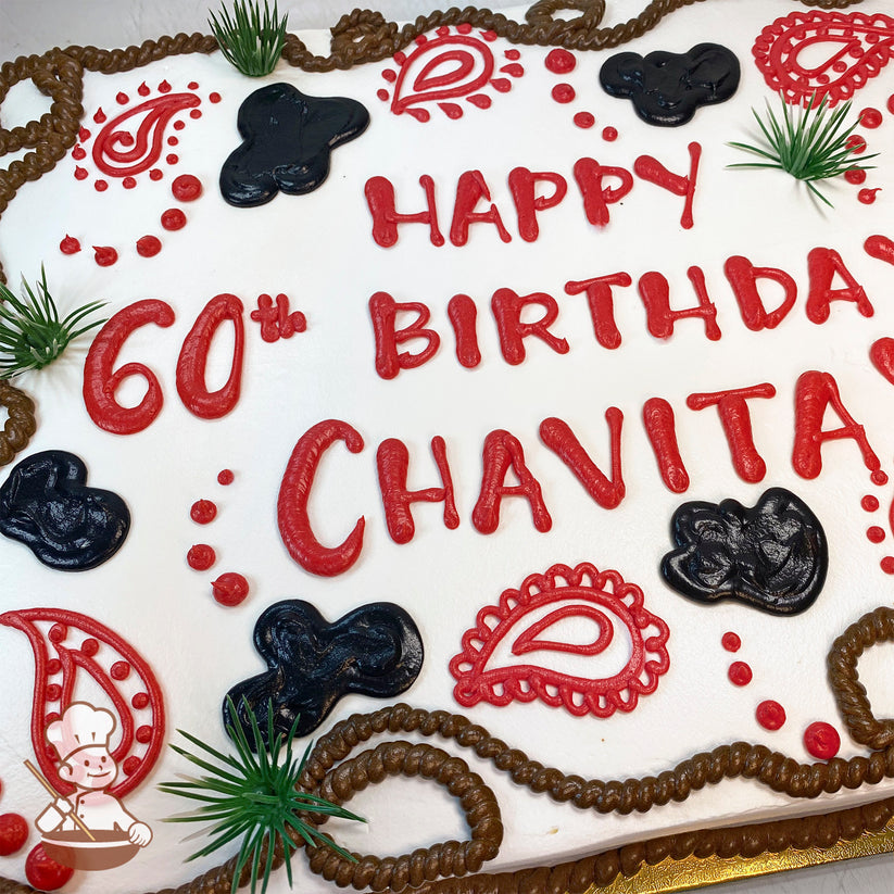 Sheet cake with white frosting, red paisley designs, black cow print shapes, green plastic grass accents, and brown buttercream rope trim.