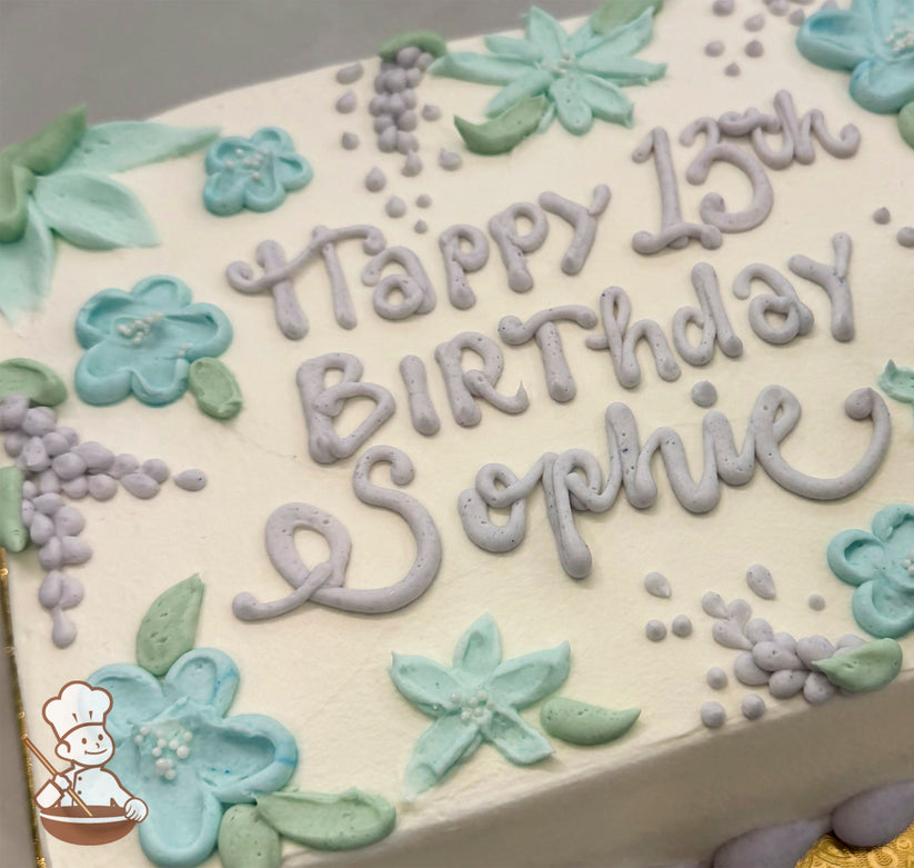 Sheet cake with white frosting, decorated with pastel purple wisteria clusters, mint green leaves, and light blue floral designs.