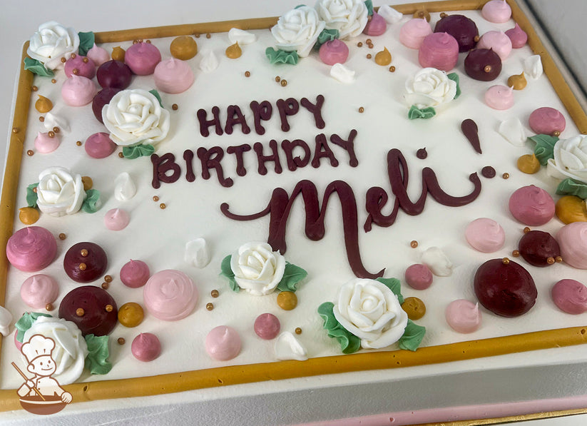 A sheet cake with white frosting, decorated with white buttercream roses, pink and burgundy dollops, gold pearl beads, and a gold border.