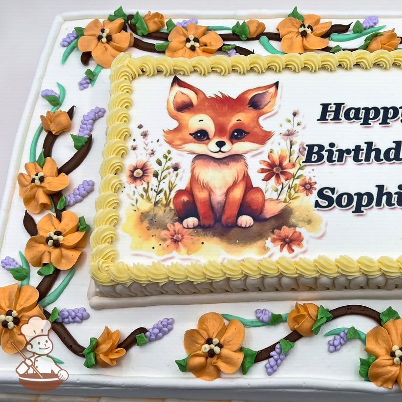 Sheet cake with buttercream decorations featuring orange blossoms, purple lavender sprigs, and green leaves on brown vines. Yellow piped border surrounds a printed photo layer.