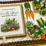 Sheet cake with buttercream decorations, featuring carrots, corn, pumpkins, lettuce, and baskets of vegetables. Brown and beige piped borders.