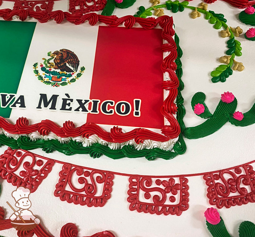 Sheet cake with red buttercream borders, green and pink cactus decorations, yellow and green vine accents, and red papel picado banner designs.