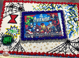 Sheet cake with Avengers-themed buttercream decorations, including spider webs, a red hourglass, yellow lightning bolts, a green Hulk fist, and "Smash" in a comic-style burst.