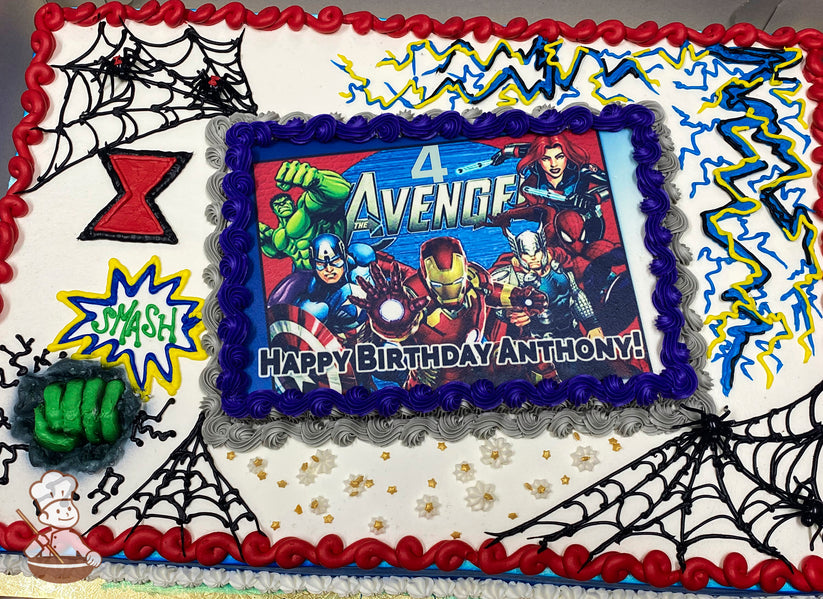 Sheet cake with Avengers-themed buttercream decorations, including spider webs, a red hourglass, yellow lightning bolts, a green Hulk fist, and "Smash" in a comic-style burst.