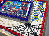 Sheet cake with Avengers-themed buttercream decorations, including spider webs, a red hourglass, yellow lightning bolts, a green Hulk fist, and "Smash" in a comic-style burst.