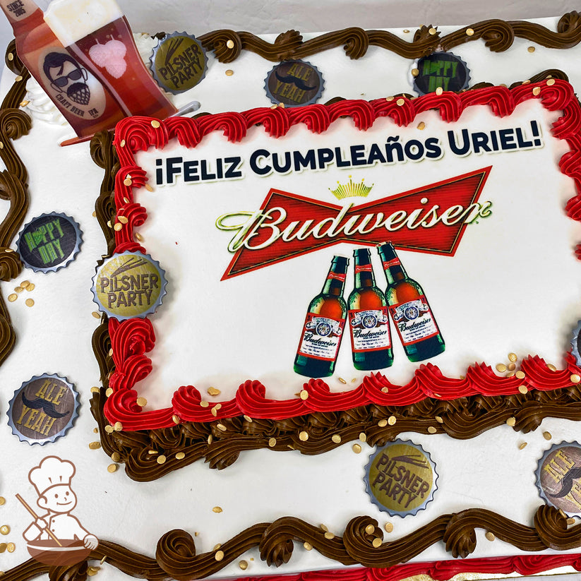 Sheet cake with red and brown buttercream swirl trims, gold confetti sprinkles, and plastic beer cap decorations featuring beer-themed phrases.
