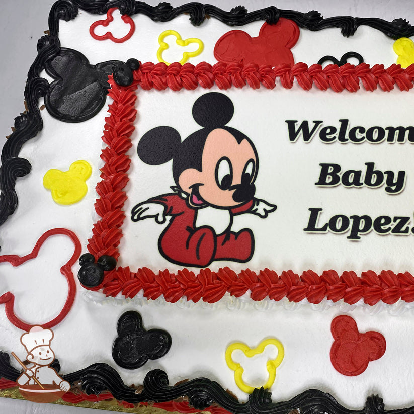 Sheet cake with white frosting, red and black piped borders, and black and yellow Mickey Mouse-shaped accents.