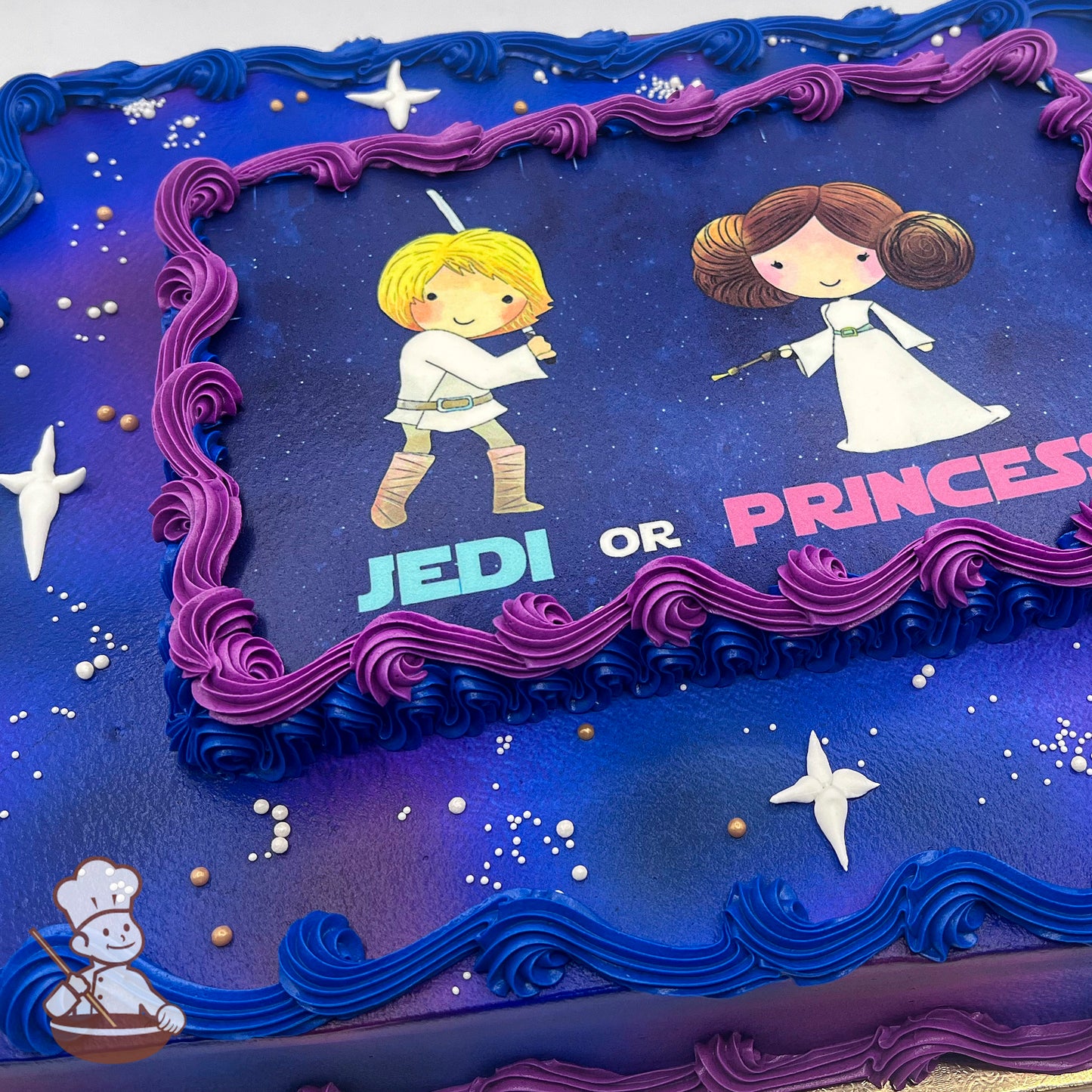 Sheet cake with a galaxy-themed design, featuring blue and purple buttercream background, white star-shaped accents, and pearl sprinkles.
