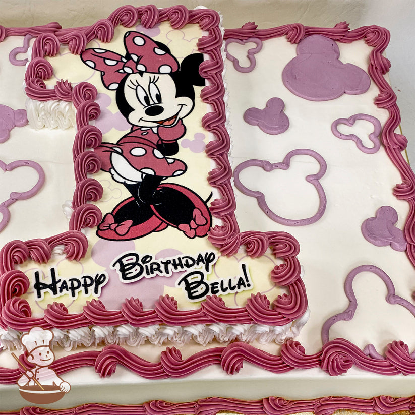 Sheet cake with buttercream decorations, featuring Minnie Mouse in a pink polka-dot outfit on a number "1" cutout. Pink Mickey-shaped patterns border the cake.