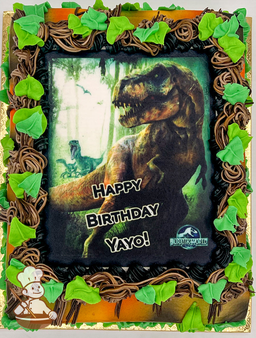 Sheet cake with jungle theme, featuring buttercream vines and green leaves around a printed photo layer.