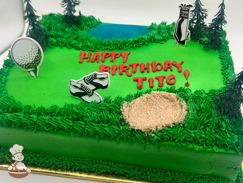 Sheet cake with green frosting resembling a golf course, featuring a sugar sand trap, plastic trees, a golf ball pick, golf shoes pick, and a golf bag pick.
