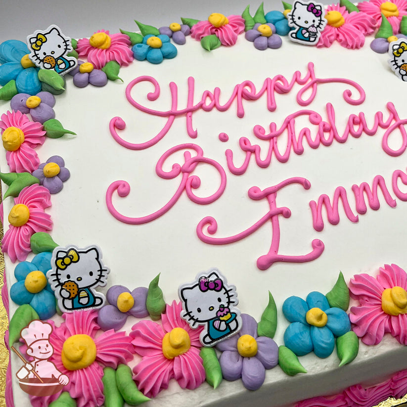 Sheet cake with white frosting, pink piped border, colorful daisies in pink, blue, and purple, and plastic Hello Kitty toppers holding treats.