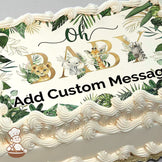 Illustration of a baby lion, elephant, giraffe, and zebra surrounded by green tropical leaves with the text "Oh BABY" printed on a photo sheet cake.