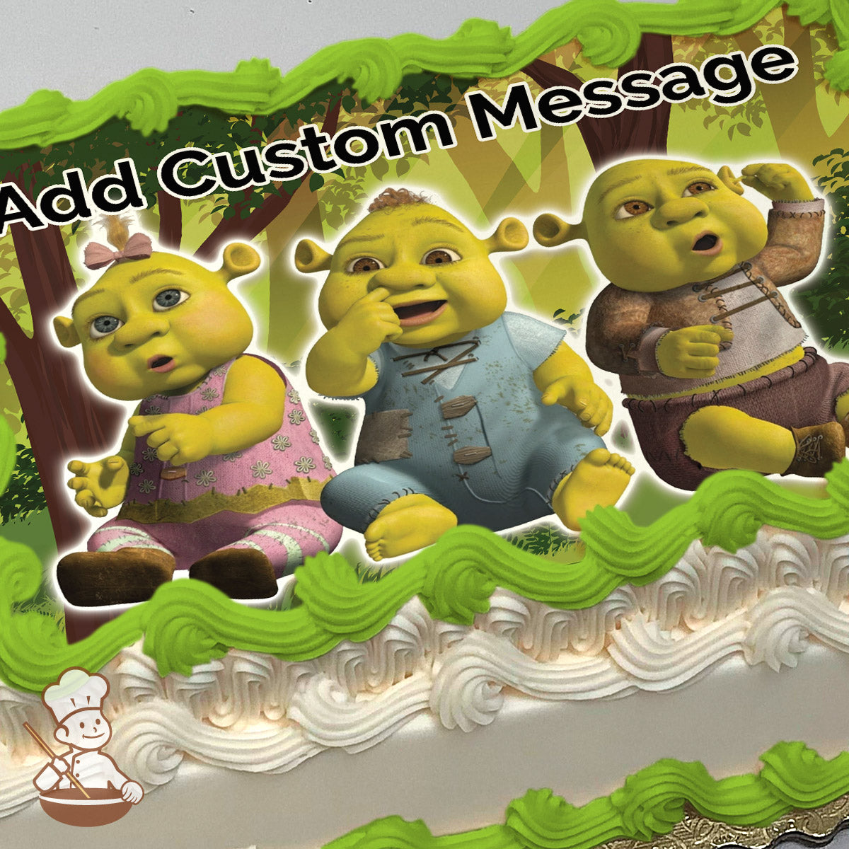 Three cartoon ogre babies are sitting together in a forest with trees and sunlight in the background, printed on a sheet cake.