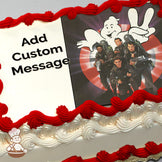 Four Ghostbusters in gray uniforms holding equipment, standing in front of a glowing ghost logo on a black background. Printed on a photo sheet cake.