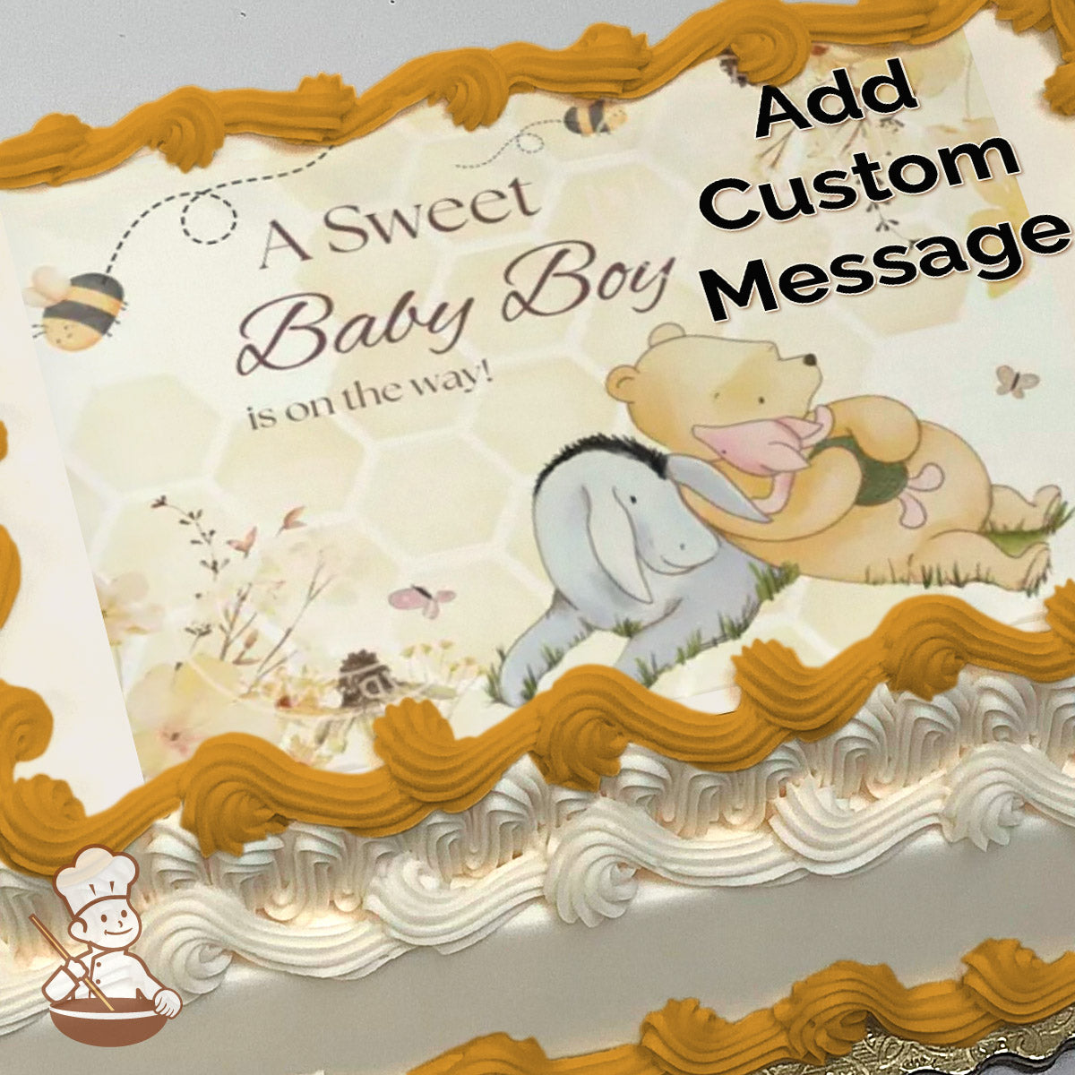 Illustration of Winnie the Pooh hugging Piglet in a grassy field with flowers, butterflies, and bees. Honeycomb-patterned background. Printed on a sheet cake.