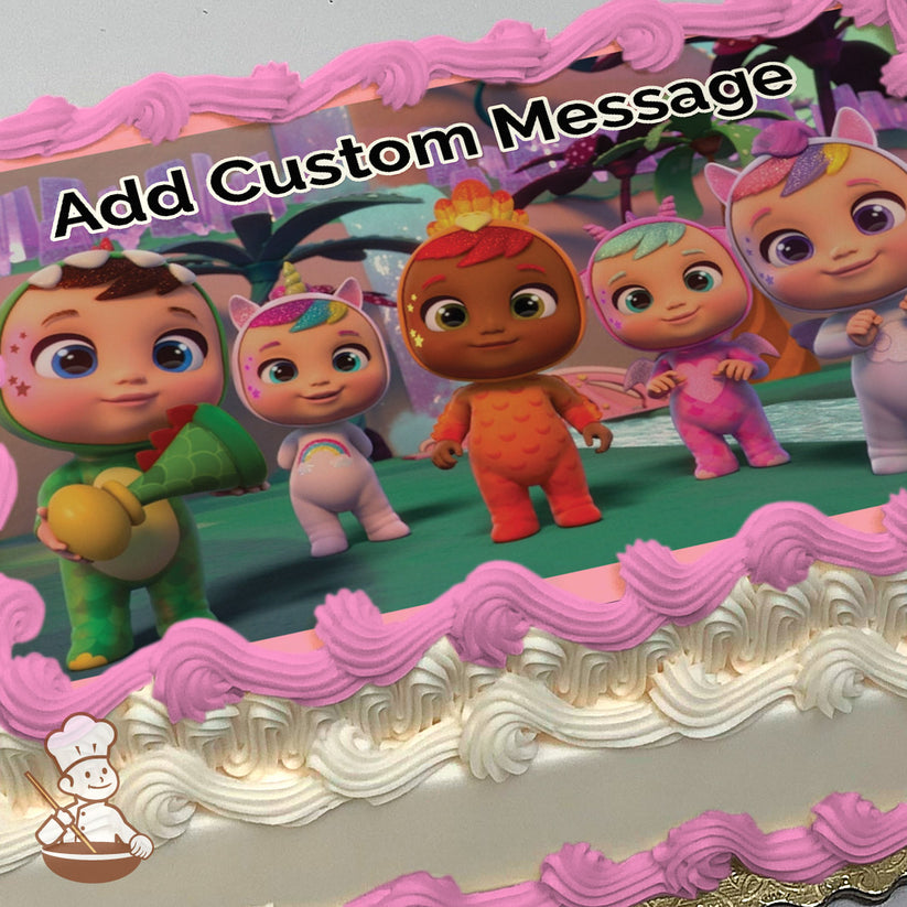 Cartoon babies in colorful animal-themed costumes stand on a green floor with a whimsical, pastel forest background. Printed on a sheet cake.