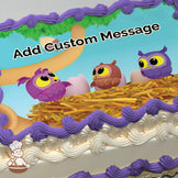 Three cartoon owls, purple, brown, and blue, sit in a nest with eggs on a tree branch against a bright blue sky. Printed on a sheet cake.