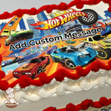 Colorful illustration of Hot Wheels cars racing on orange tracks with a city skyline in the background, printed on a photo sheet cake.