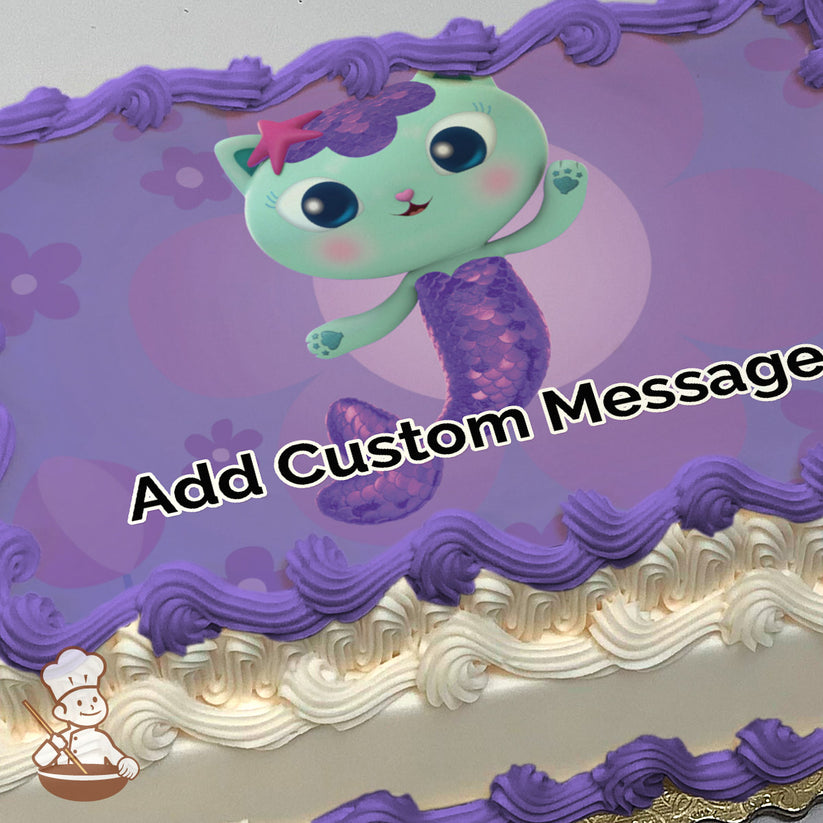 A cartoon green cat with a purple mermaid tail and a pink starfish on its head, set against a purple background with flower patterns, printed on a sheet cake.