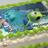 Sulley, a large blue monster, holds a small child while Mike, a green one-eyed monster, looks surprised in a factory setting. Printed on a sheet cake.