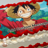 A cartoon character with a straw hat, wide grin, and red shirt stands in front of a lush, green forest under a blue sky, printed on a sheet cake.