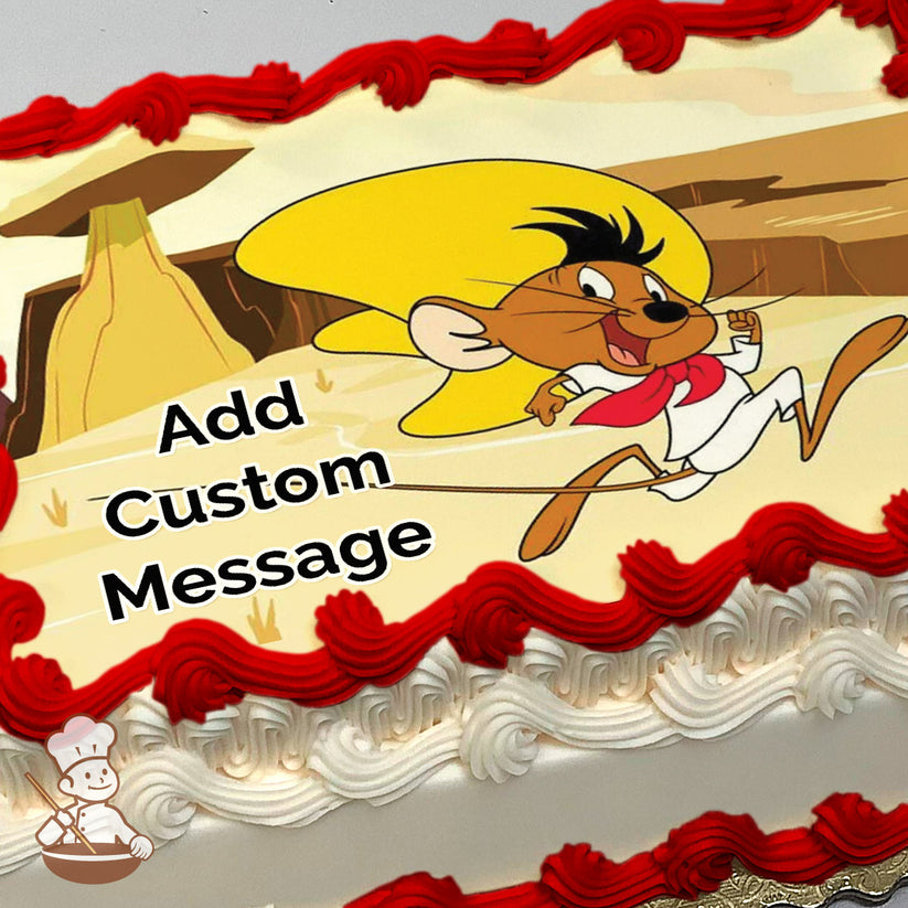 A cartoon mouse wearing a yellow sombrero, white outfit, and red scarf runs energetically in a desert landscape with cliffs. Printed on a sheet cake.