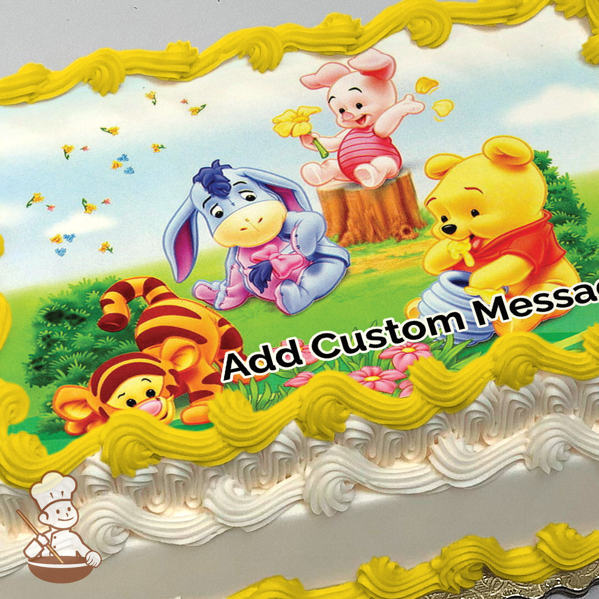 Cartoon illustration of Winnie the Pooh, Piglet, and Eeyore in a grassy field with flowers and a tree stump. Printed on a sheet cake.