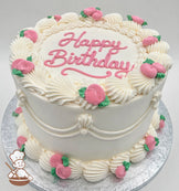 Round cake with white frosting, pink "Happy Birthday" text, and pink rosette decorations with green leaves. Placed on a silver board.