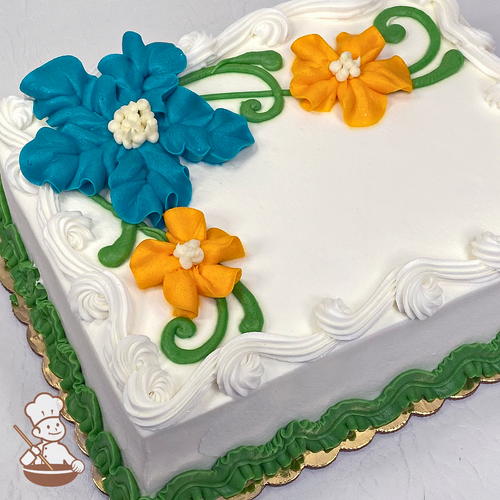 Sheet cake with Hawaiian flowers and whipped cream.