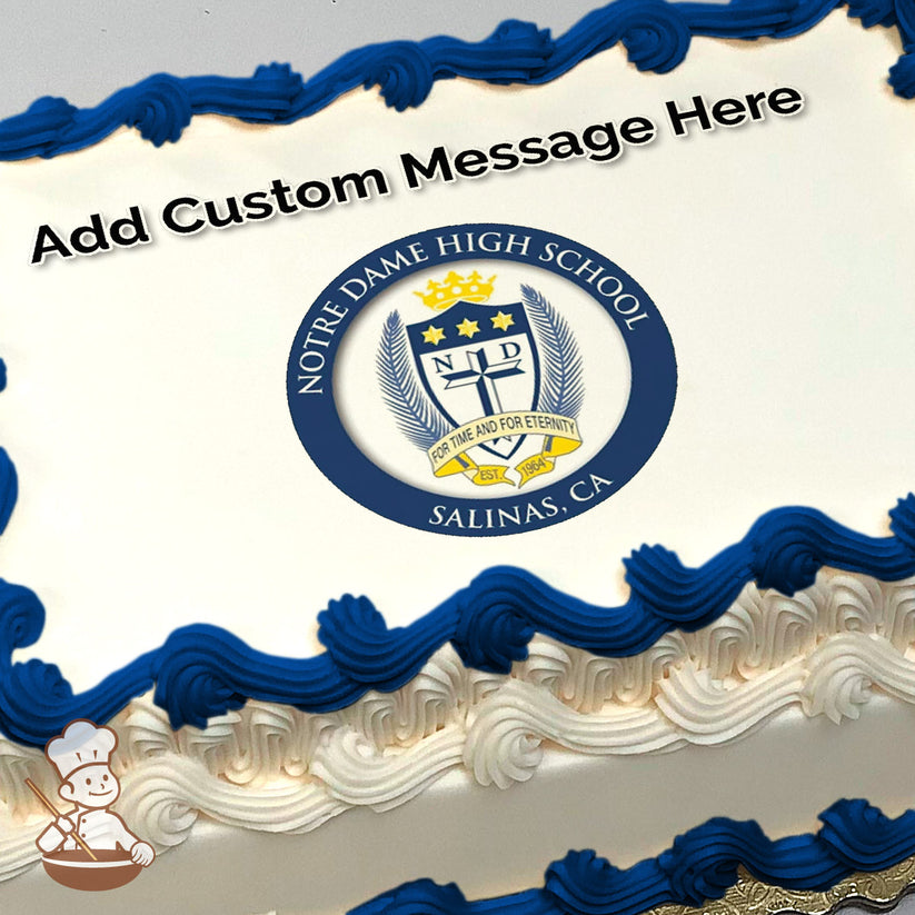 Notre Dame High School crest featuring a cross, stars, and laurel leaves on a blue circular background, printed on a photo sheet cake.